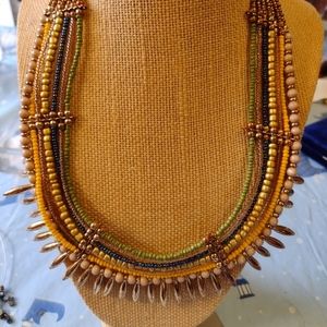 Boho multi strand beaded necklace with gold tone accents